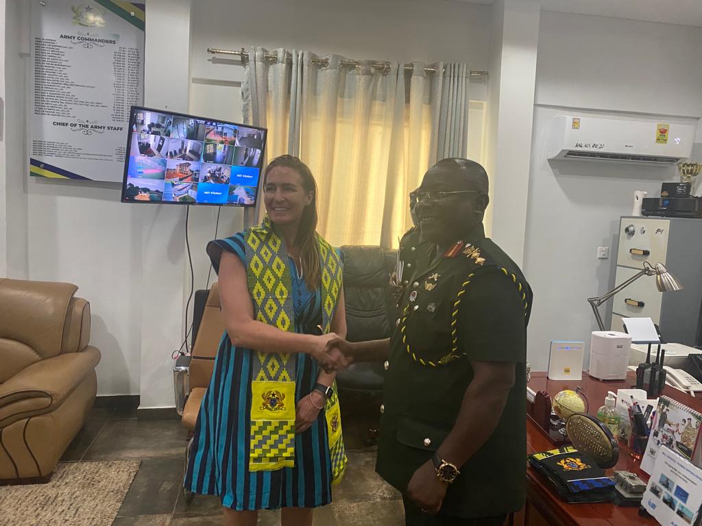 Sarah D'Amico meeting with a senior Ghanaian military official